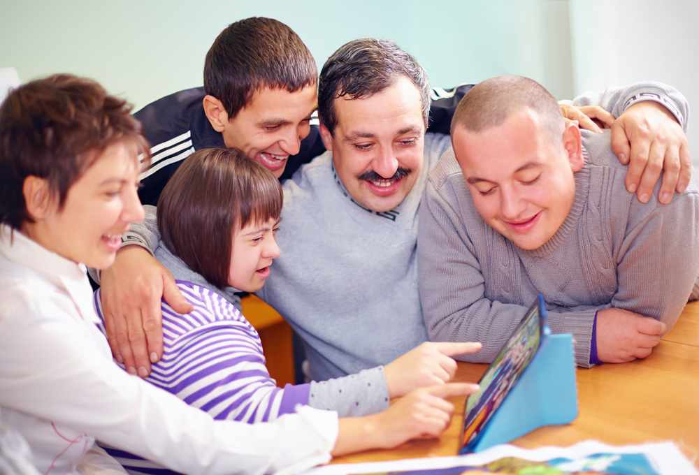 Group,Of,Happy,People,With,Disability,Having,Fun,With,Tablet