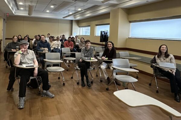 a group of people sitting in chairs in a room