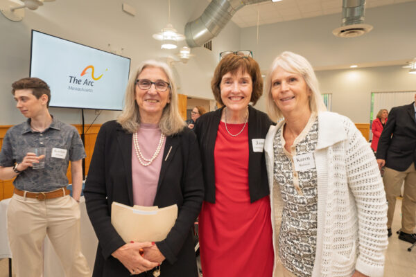 a group of women standing next to each other