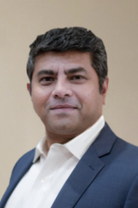 Subhadeep Basu a man in a suit and tie posing for a picture