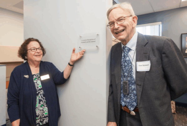 a man and a woman standing next to each other