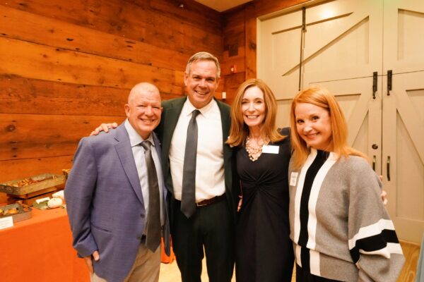 Representative John Lawn (second from left), who was integral in passing the OHC legislation as Chairman of the Joint Committee on Health Care Financing