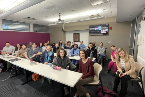 a group of people sitting around a table