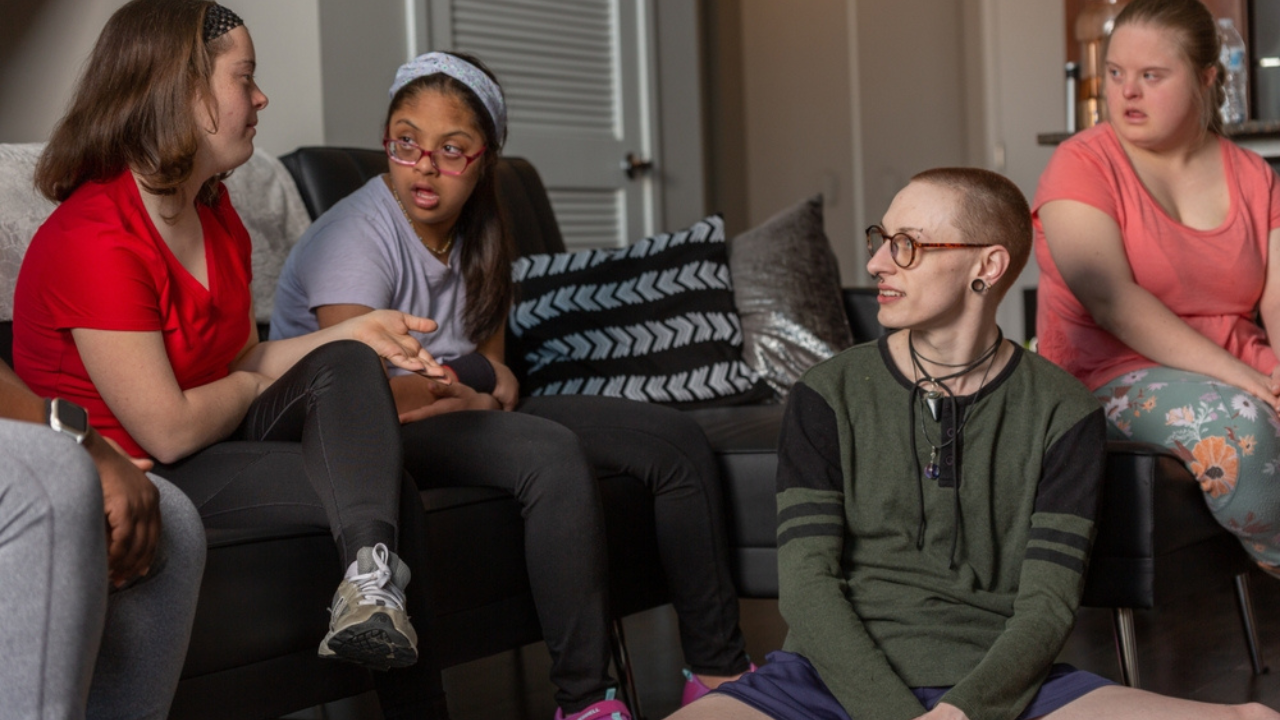 a group of people sitting in a living room
